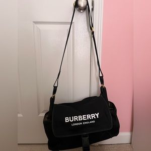 Black Burberry diaper bag gold hardware signature lining